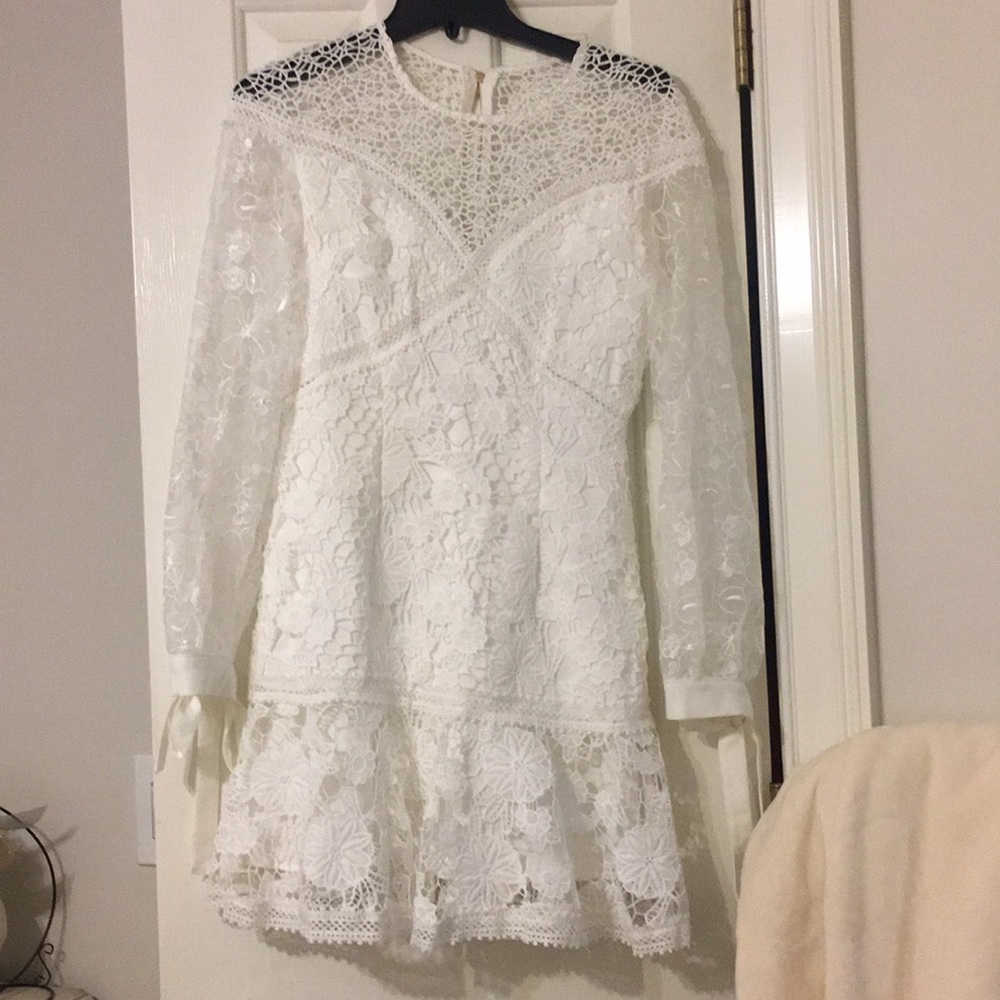 White lace dress. Bad zipper. Reduced price.